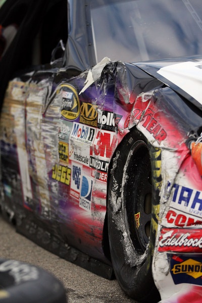 Denny Hamlin finds that first turn Kansas wall just as hard as Dale Earnhardt